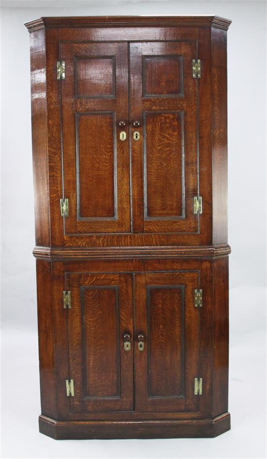 A George III oak corner cupboard, W.3ft 3in. H.6ft 7in.